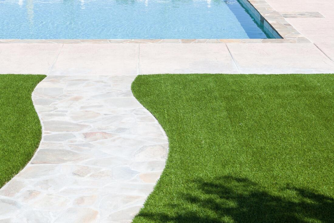 backyard and near the pool artificial grass